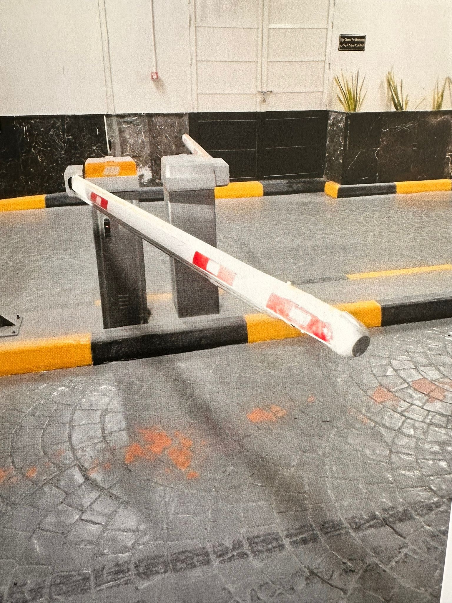 Installed parking barrier in a covered parking area