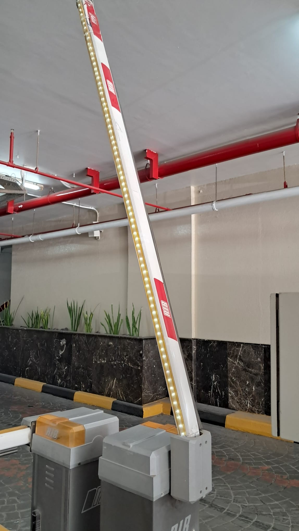 Automatic barrier arm in raised position